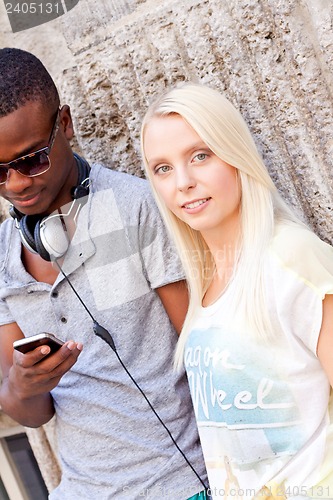 Image of happy young couple have fun in the city summertime 