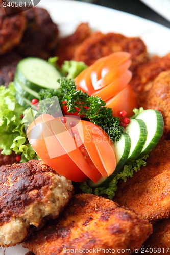 Image of Crumbed fried meat and fish on a buffet