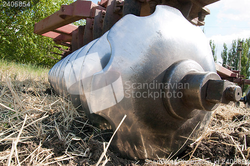 Image of closeup agricultural machine on the field