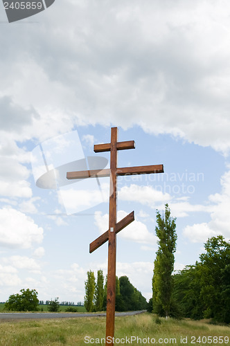 Image of orthodox cross on near road