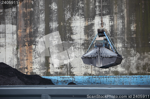 Image of Bucket suspended from a crane