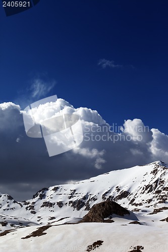 Image of Snowy mountains and blue sky with clouds