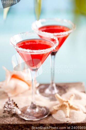 Image of red drink on beach