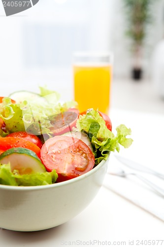 Image of vegetable salad with juice