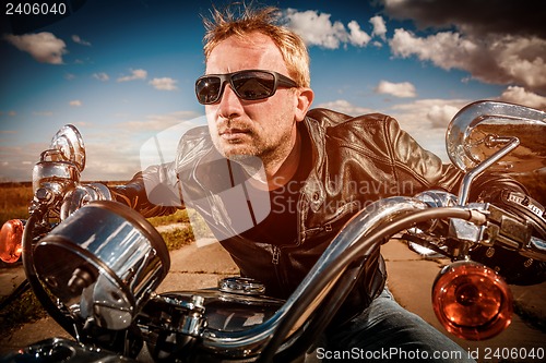 Image of Biker racing on the road