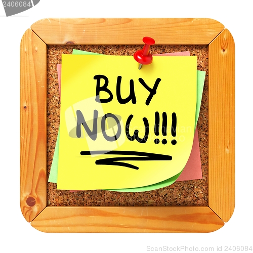 Image of Buy Now!!!. Yellow Sticker on Bulletin.