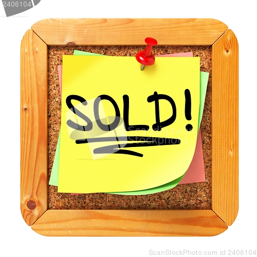 Image of Sold!. Yellow Sticker on Bulletin.