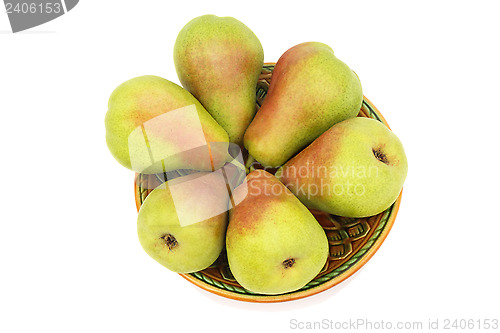 Image of Ripe pears on the plate on a white background.