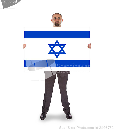 Image of Smiling businessman holding a big card, flag of Israel