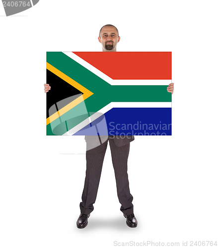 Image of Smiling businessman holding a big card, flag of South Africa