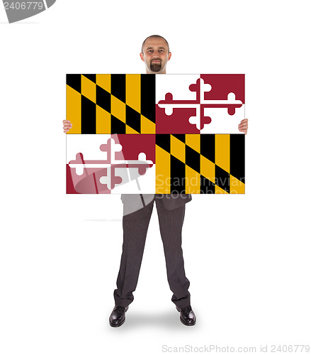 Image of Smiling businessman holding a big card, flag of Maryland