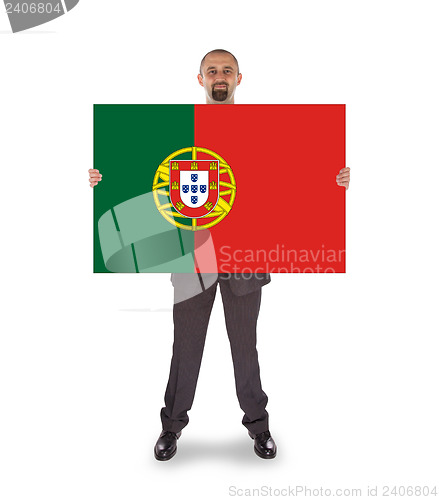 Image of Smiling businessman holding a big card, flag of Portugal