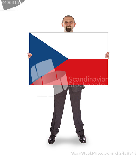 Image of Smiling businessman holding a big card, flag of the Czech Republ