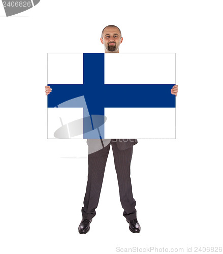 Image of Smiling businessman holding a big card, flag of Finland