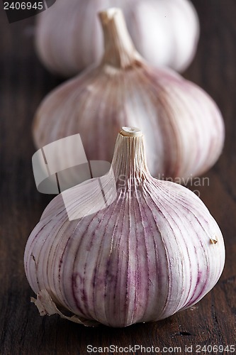 Image of Garlic on a brown wooden table