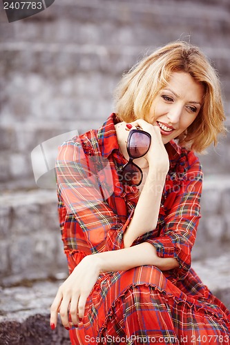 Image of Beautiful girl in a red dress