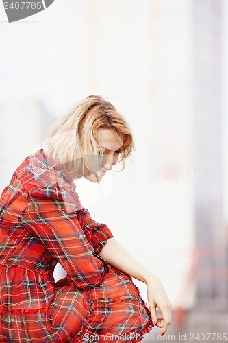 Image of Beautiful girl in a red dress