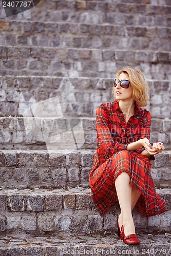 Image of Beautiful girl in a red dress