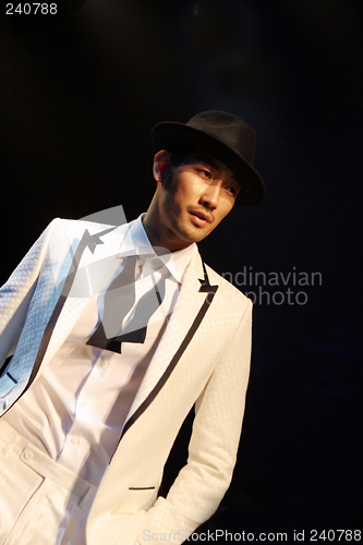 Image of Asian male model on the catwalk