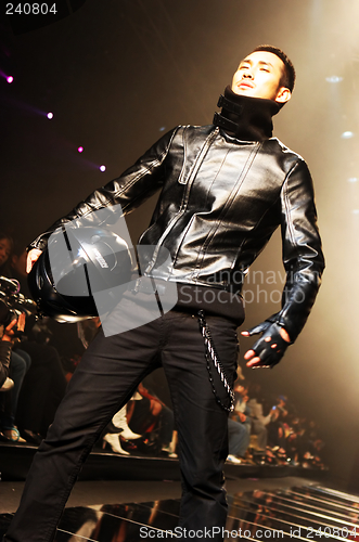 Image of Asian male model on the catwalk