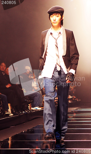 Image of Asian male model on the catwalk