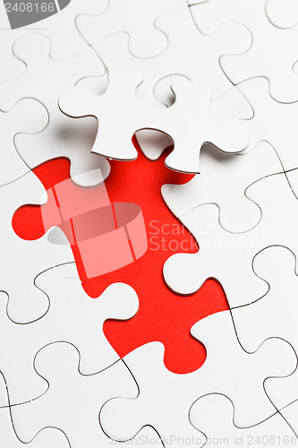 Image of Incomplete puzzle with missing piece