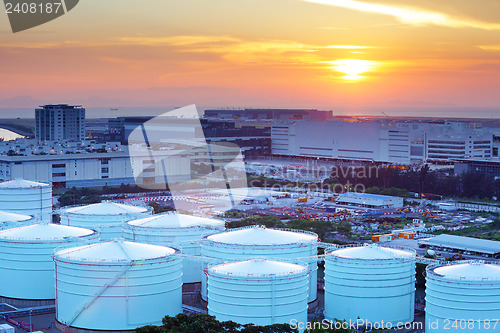 Image of Oil tanks for cargo service during sunset