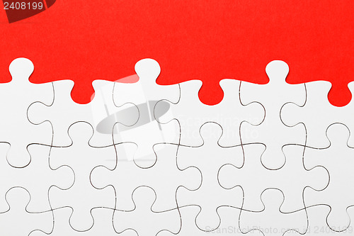 Image of Incomplete puzzle in red color