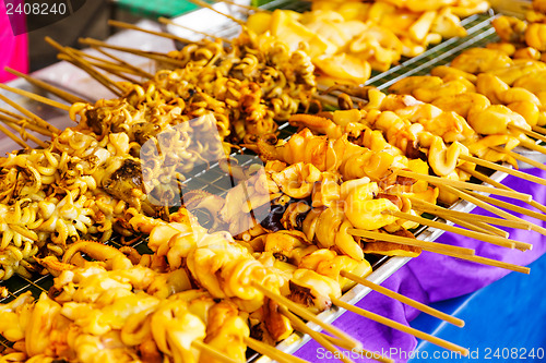 Image of Thai style roasted stick on street