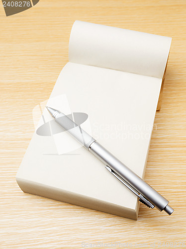 Image of Memo pad and pen