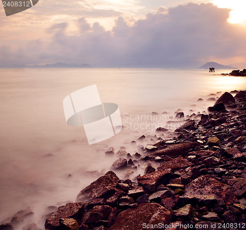 Image of Sunset sea coast and stone