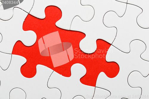 Image of Incomplete puzzle with missing piece