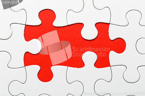 Image of Incomplete puzzle with missing piece