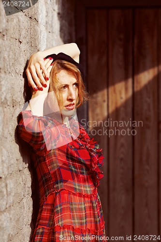 Image of Beautiful girl in a red dress