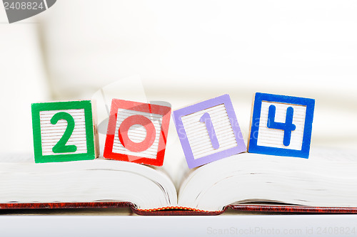 Image of Alphabet block with 2014 on book