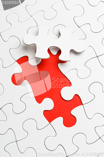 Image of Incomplete puzzle with missing piece