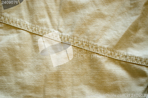 Image of closeup of  bright pant fabric stitch background