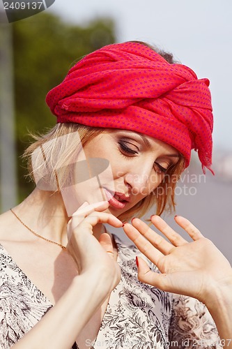 Image of Girl with red elements of clothing