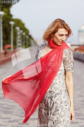 Image of Girl with red elements of clothing