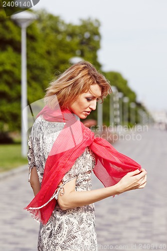 Image of Girl with red elements of clothing