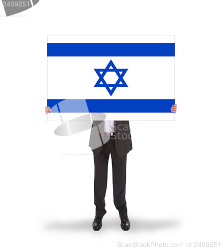 Image of Smiling businessman holding a big card, flag of Israel