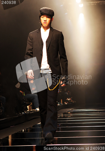 Image of Asian male model on the catwalk