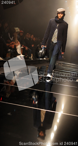 Image of Asian male model on the catwalk