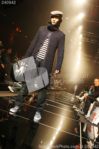 Image of Asian male model on the catwalk