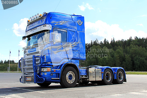 Image of Blue Decorated Scania Truck on a Parking Lot