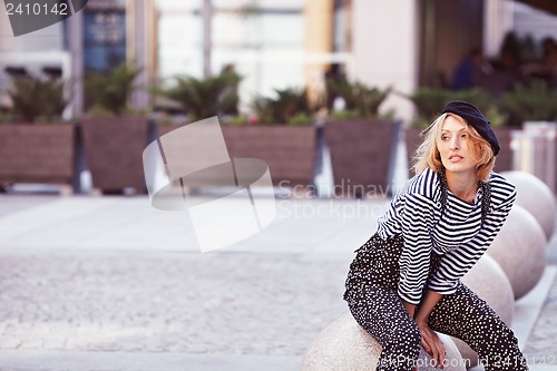 Image of Beautiful girl in the striped vest