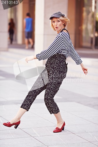 Image of Beautiful girl in the striped vest