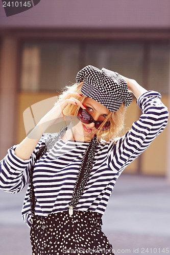 Image of Beautiful girl in the striped vest