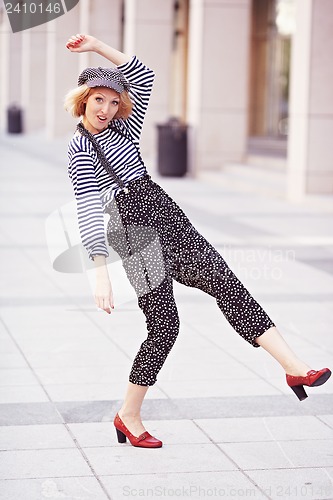 Image of Beautiful girl in the striped vest