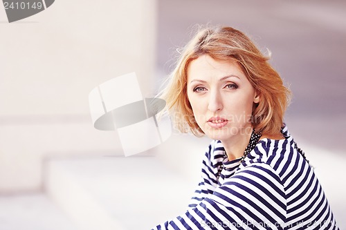 Image of Beautiful girl in the striped vest